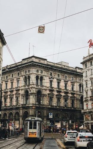 Notebook: Street tram car Milan building structure road sidewalk thoroughfare alley main street