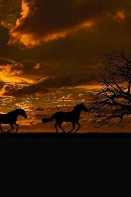 Wild Horses Running Free Across The Landscape At Dusk